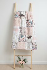 Blush and gray blanket on ladder