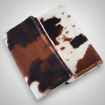 Freshened cow print burp cloths
