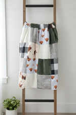 Highland cow patchwork blanket on ladder