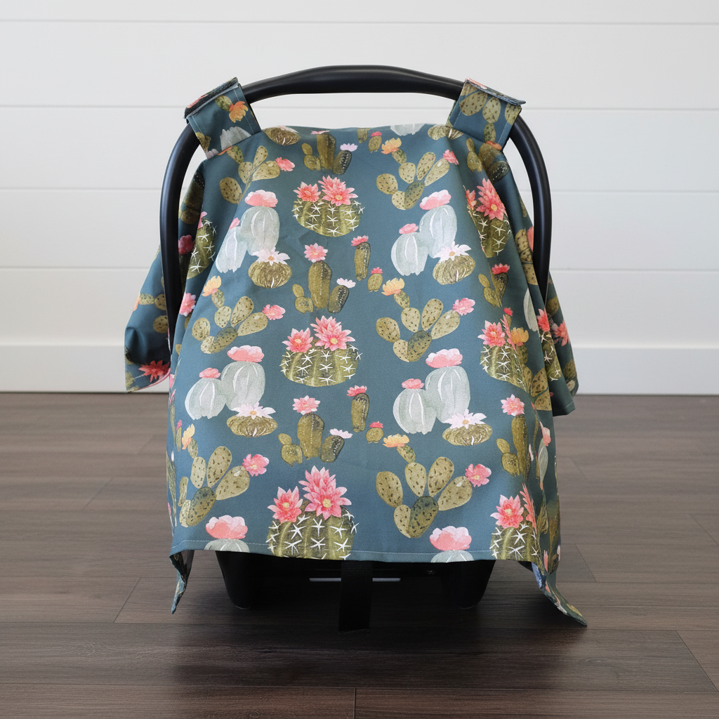 Floral Blooming Cactus Western Carseat Tent against white shiplap wall — blooming cactus and floral print with coral cotton underside, handmade in the USA