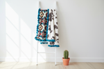 Cream Aztec and Brownie Calf Minky Western Ruffle Blanket on white blanket ladder