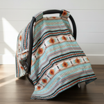Mint Aztec Western Carseat Tent against white shiplap wall — bold mint aztec print with gray cotton underside, handmade in the USA