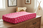 Hot pink arrow changing pad cover on dresser in western nursery - lifestyle photo