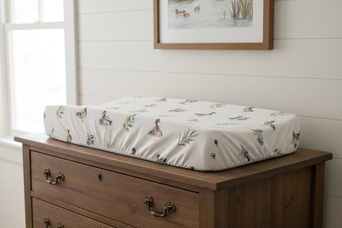 Mallard duck changing pad cover on antique dresser with woodland decor - lifestyle photo
