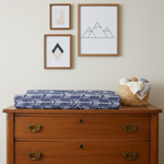 Navy Arrow Western Changing Pad Cover on Brown Dresser with Wall Art