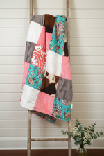 Turquoise Pink Cow Print Blanket Lifestyle on Ladder